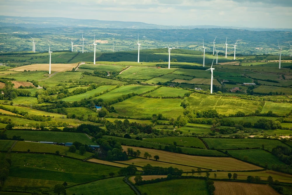 Beautiful green landscape with windmills viewed from the air