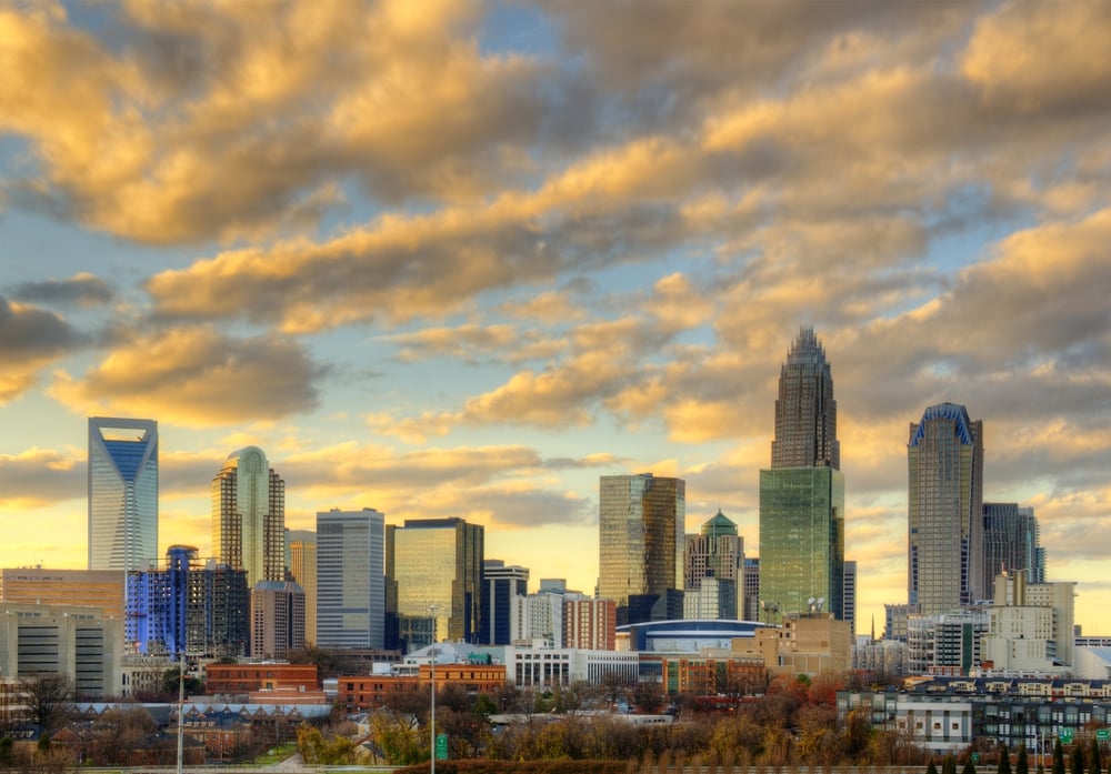 Skyline of Uptown Charlotte, North Carolina under dramatic cloud cover.